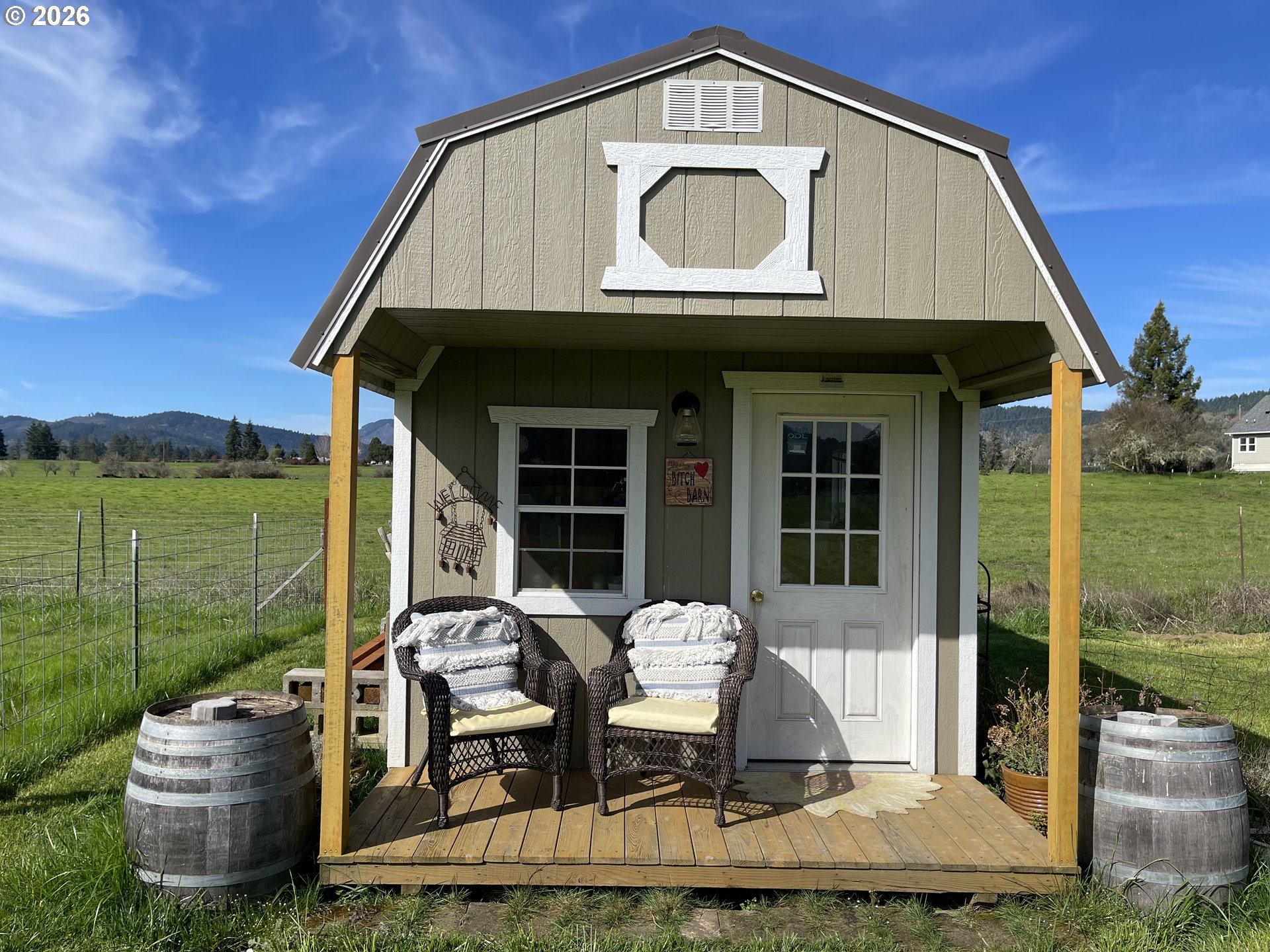 6404 Lookingglass Road Roseburg, OR 97471 - Photo 33 of 48 a front view of a house with garden