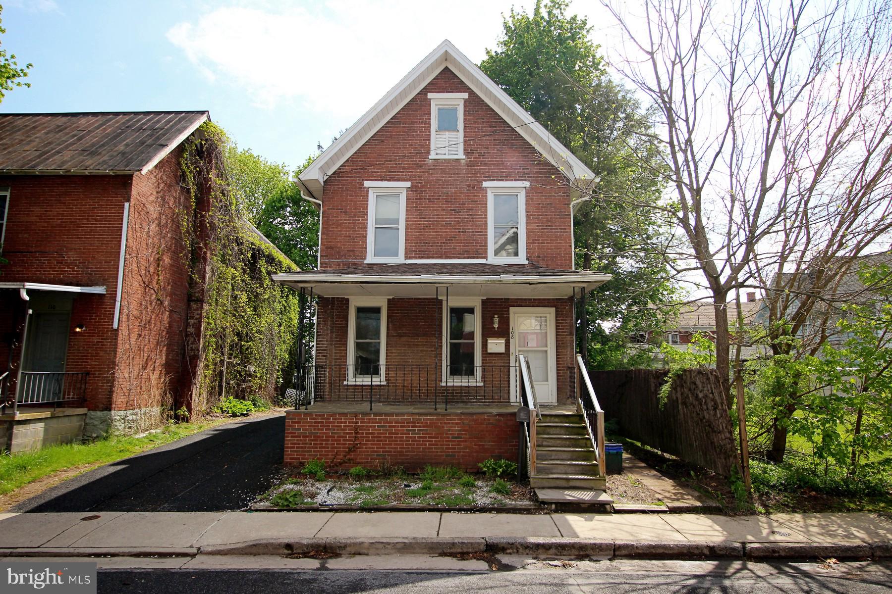 108 Mill Street Lock Haven, PA 17745 - Photo 1 of 26 a front view of a house with garden