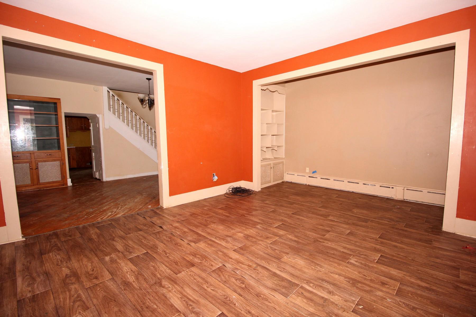 108 Mill Street Lock Haven, PA 17745 - Photo 13 of 26 an empty room with wooden floor and entrance