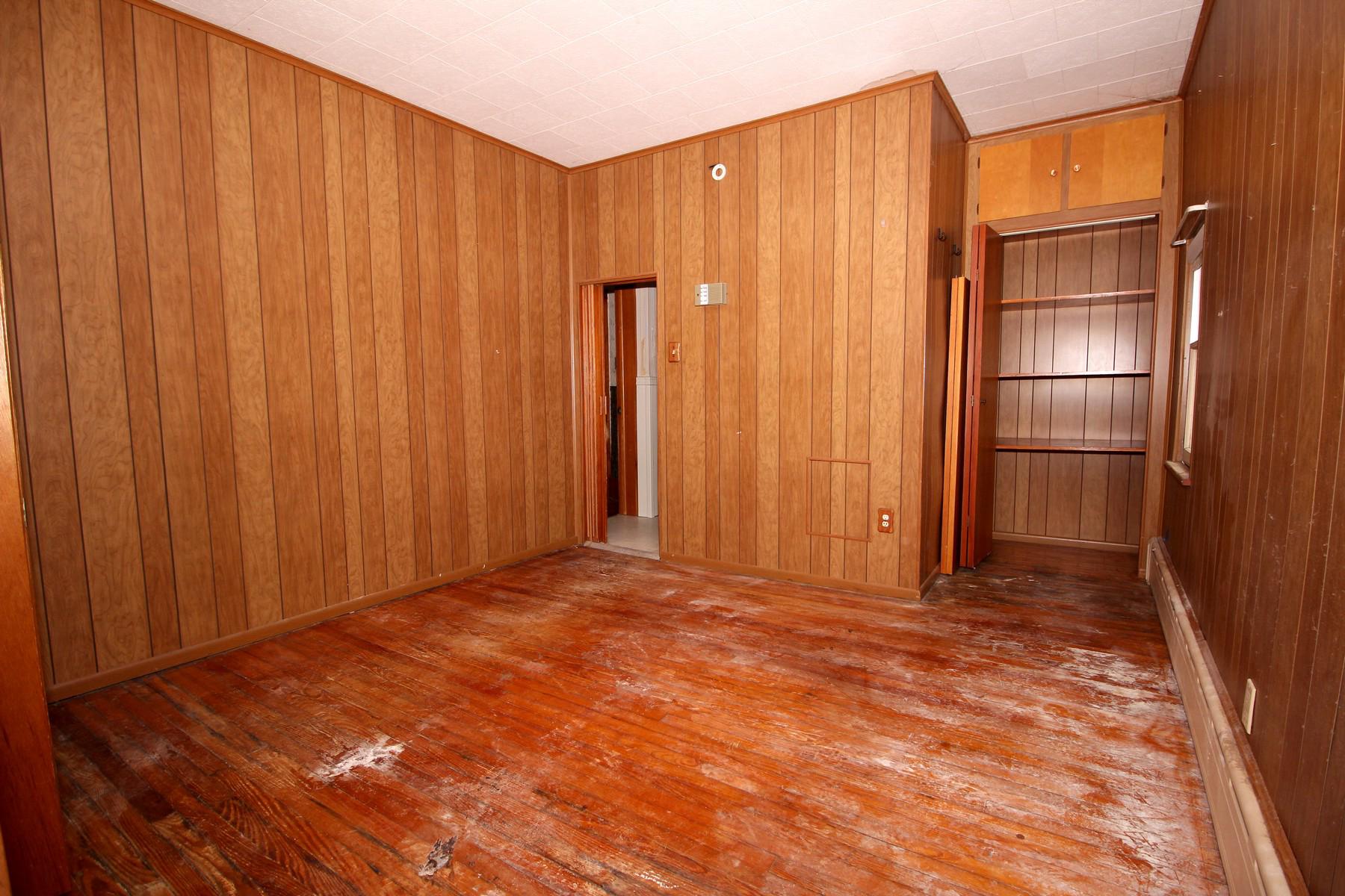 108 Mill Street Lock Haven, PA 17745 - Photo 15 of 26 a view of an empty room with wooden walls