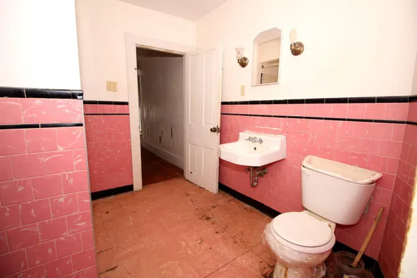 a bathroom with a bathtub and a sink