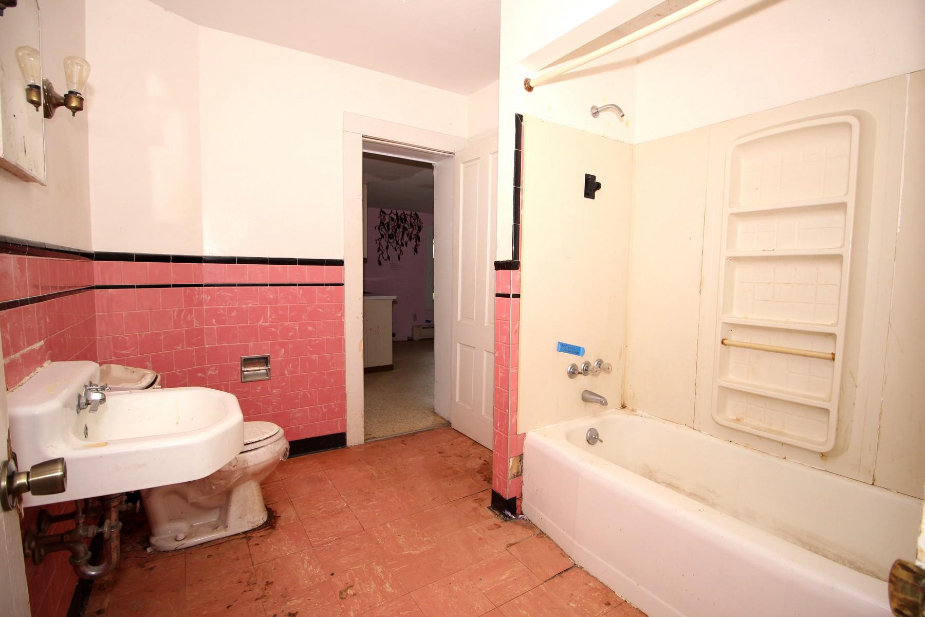 108 Mill Street Lock Haven, PA 17745 - Photo 24 of 26 a bathroom with a bathtub and a sink