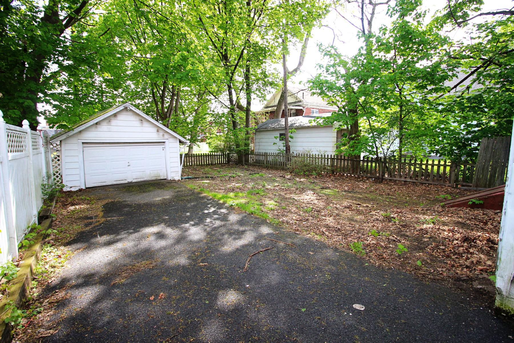 108 Mill Street Lock Haven, PA 17745 - Photo 5 of 26 a front view of a house with a yard and garage