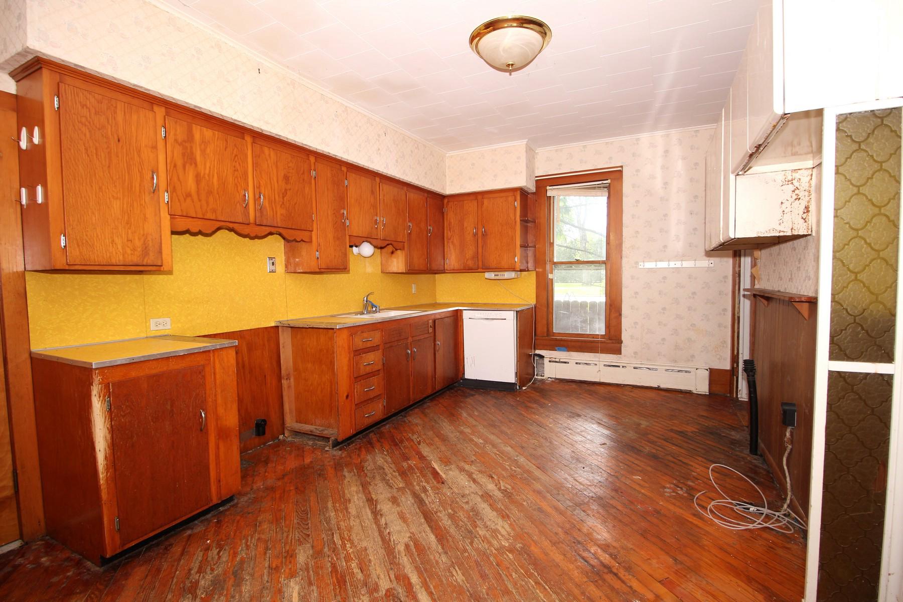 108 Mill Street Lock Haven, PA 17745 - Photo 7 of 26 a view of a kitchen with wooden floor and electronic appliances
