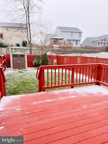 a view of a yard with a bench and trees
