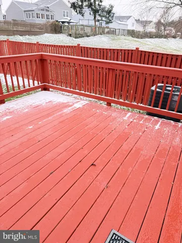 a view of balcony with wooden floor