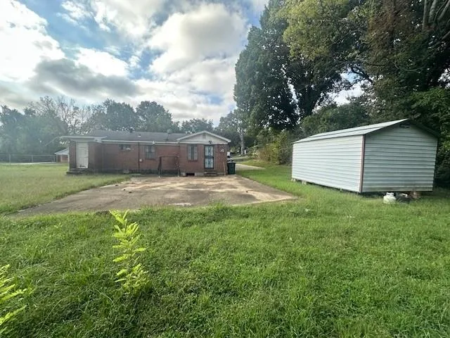 a view of a backyard with a garden