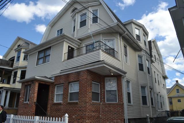 40 Vine Street, Unit 3 Bridgeport, CT 06604 - Photo 1 of 1 a front view of a residential apartment building with a door