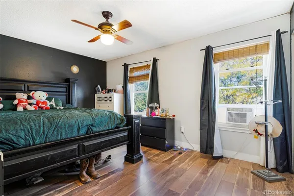 a bedroom with bed and a chandelier