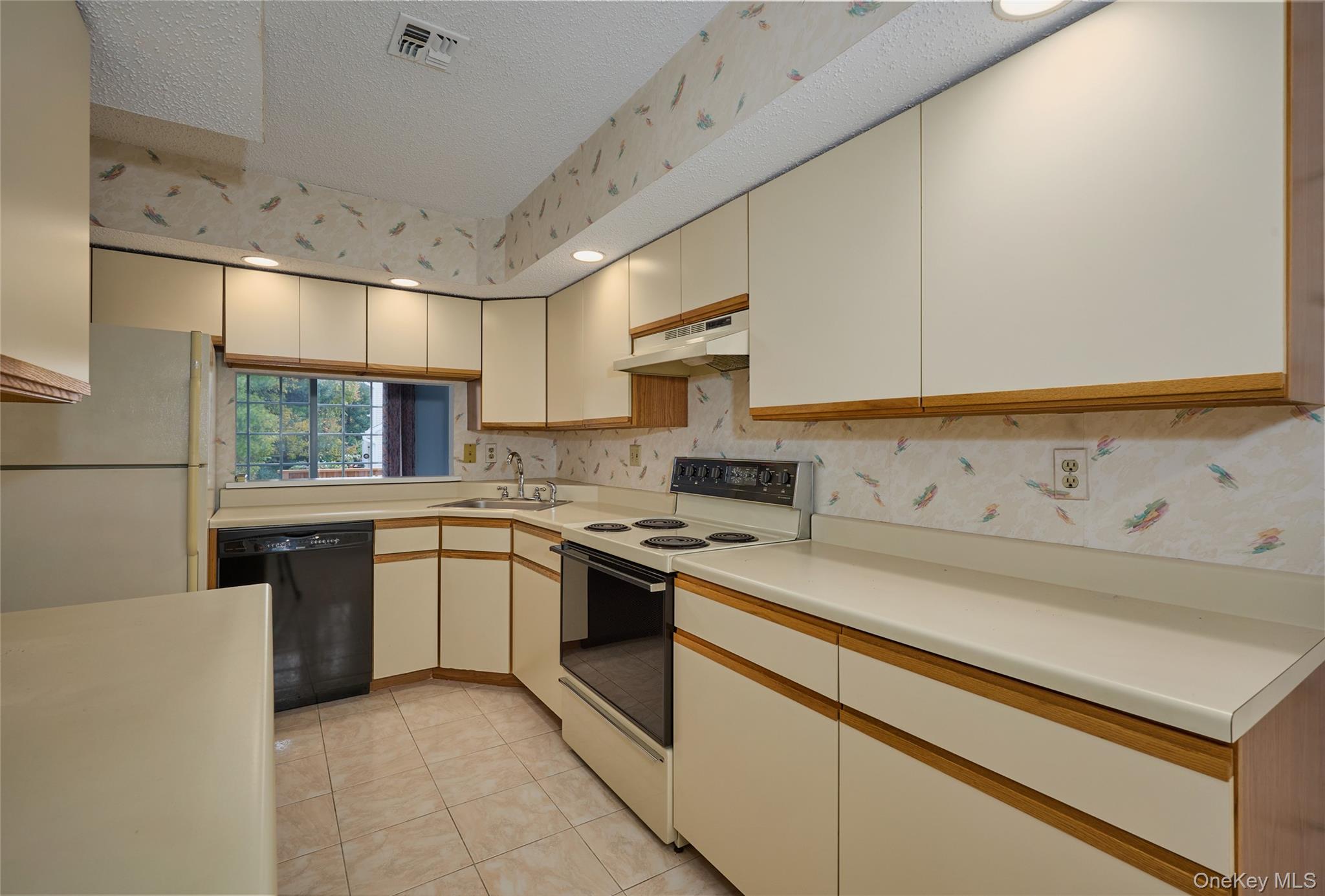 43 Spruce Ridge Drive Fishkill, NY 12524 - Photo 20 of 44 a kitchen with a stove sink and cabinets
