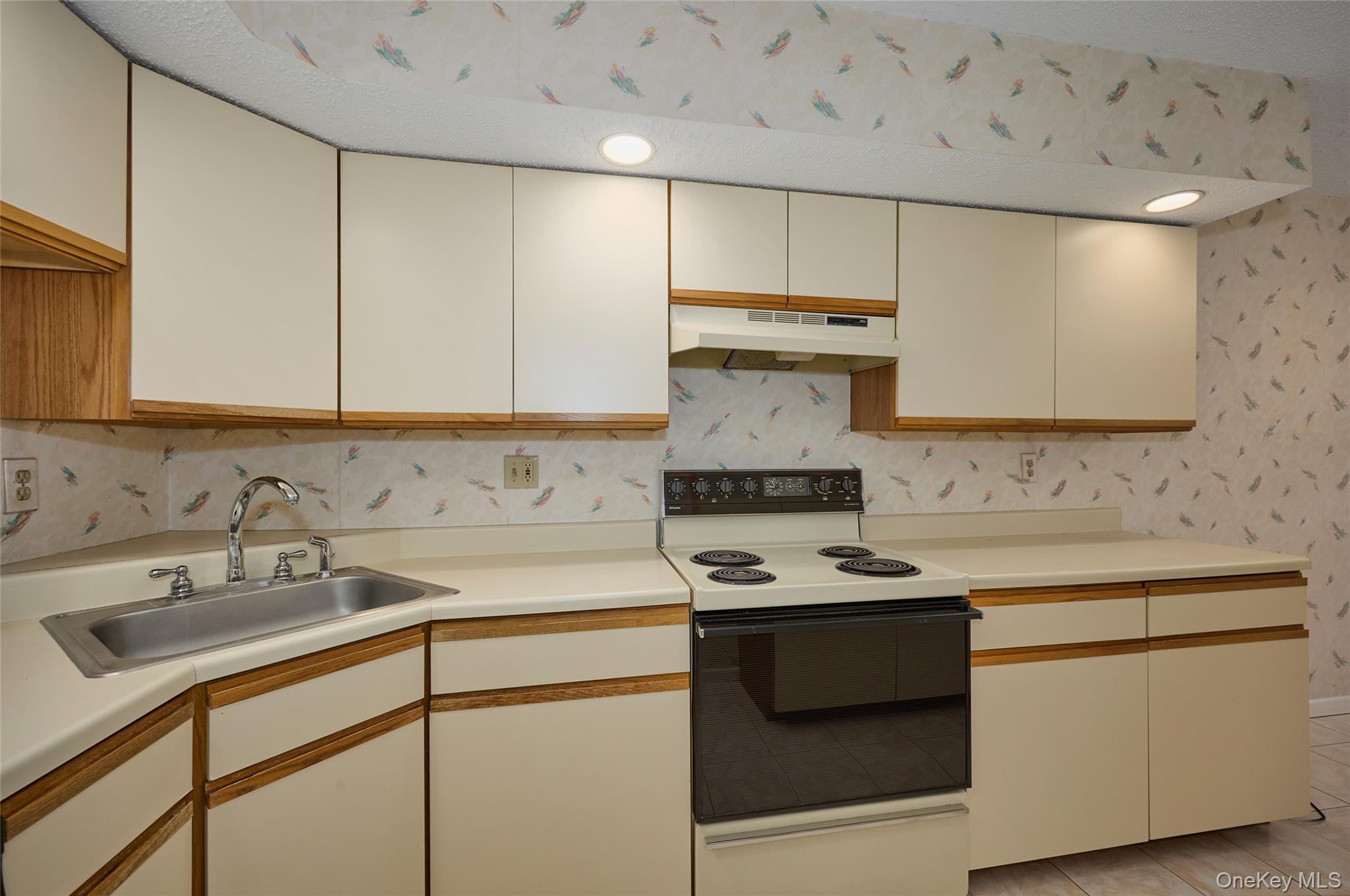 43 Spruce Ridge Drive Fishkill, NY 12524 - Photo 23 of 44 a kitchen with stainless steel appliances a stove a sink and a refrigerator