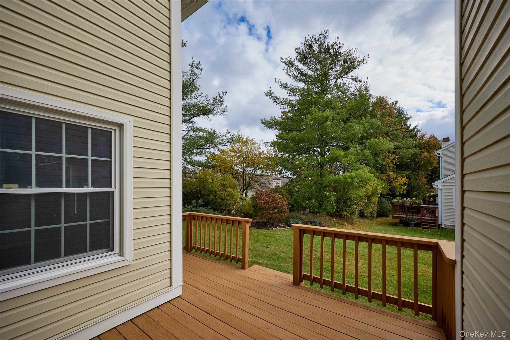 43 Spruce Ridge Drive Fishkill, NY 12524 - Photo 3 of 44 a view of a balcony with wooden floor and fence