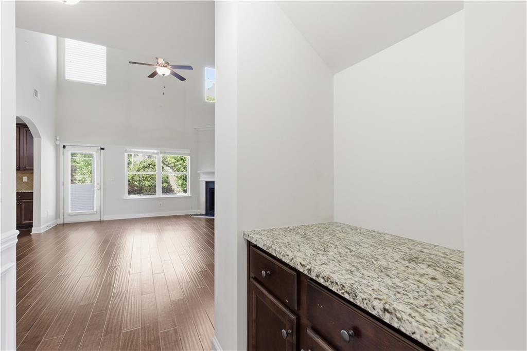 2573 Madison Mae Lane Grayson, GA 30017 - Photo 13 of 51 an empty room with wooden floor and windows