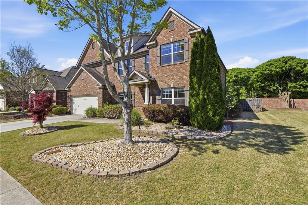 2573 Madison Mae Lane Grayson, GA 30017 - Photo 2 of 51 a front view of a house with a yard
