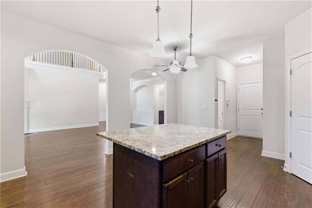 2573 Madison Mae Lane Grayson, GA 30017 - Photo 21 of 51 a kitchen with a table and chairs