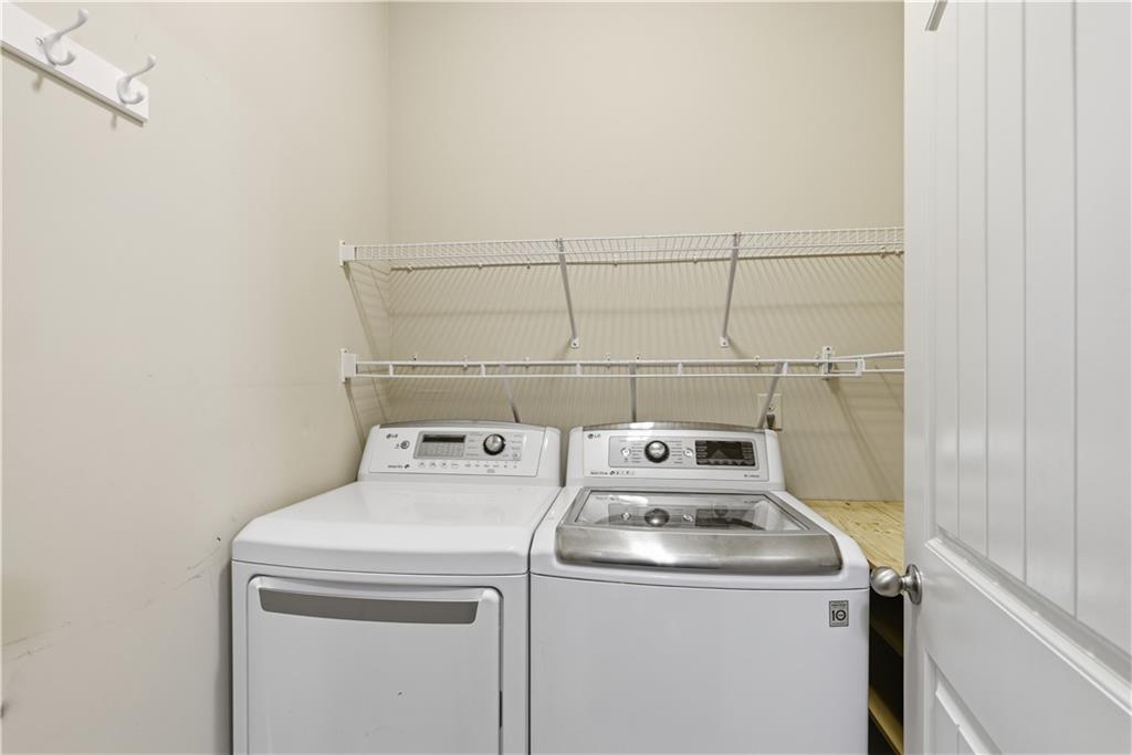 2573 Madison Mae Lane Grayson, GA 30017 - Photo 23 of 51 a utility room with dryer and washer