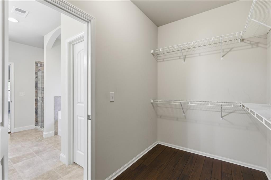 2573 Madison Mae Lane Grayson, GA 30017 - Photo 30 of 51 a view of a room with racks on the wall