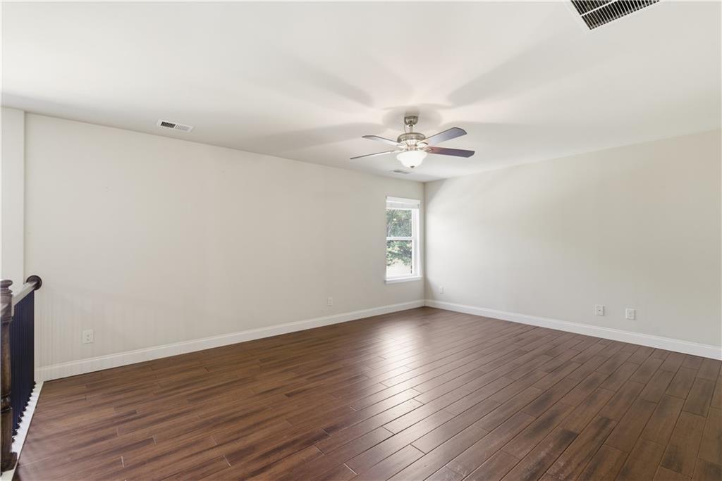 2573 Madison Mae Lane Grayson, GA 30017 - Photo 35 of 51 a view of an empty room with wooden floor