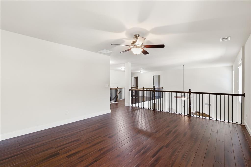 2573 Madison Mae Lane Grayson, GA 30017 - Photo 36 of 51 a view of a room with wooden floor