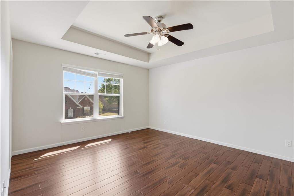 2573 Madison Mae Lane Grayson, GA 30017 - Photo 41 of 51 a view of an empty room with wooden floor and a window