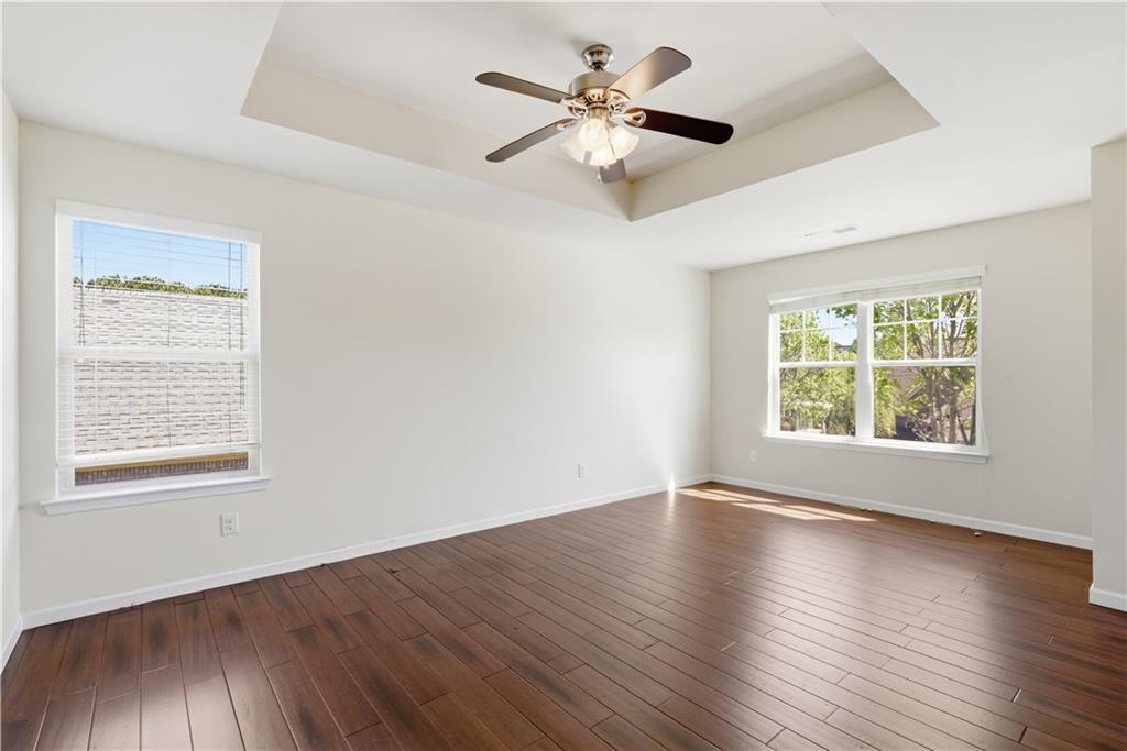 2573 Madison Mae Lane Grayson, GA 30017 - Photo 42 of 51 a view of an empty room with wooden floor and a window