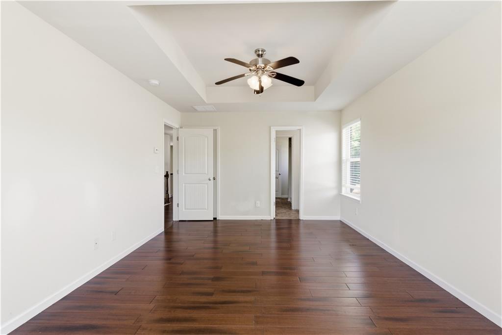 2573 Madison Mae Lane Grayson, GA 30017 - Photo 43 of 51 a view of an empty room with wooden floor and a window