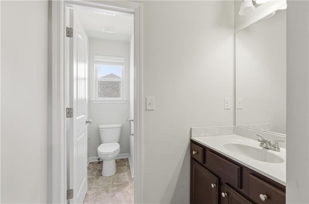 2573 Madison Mae Lane Grayson, GA 30017 - Photo 45 of 51 a bathroom with a sink a toilet and shower