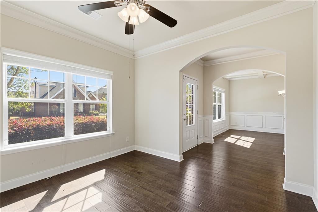 2573 Madison Mae Lane Grayson, GA 30017 - Photo 8 of 51 a view of an empty room with wooden floor and a window