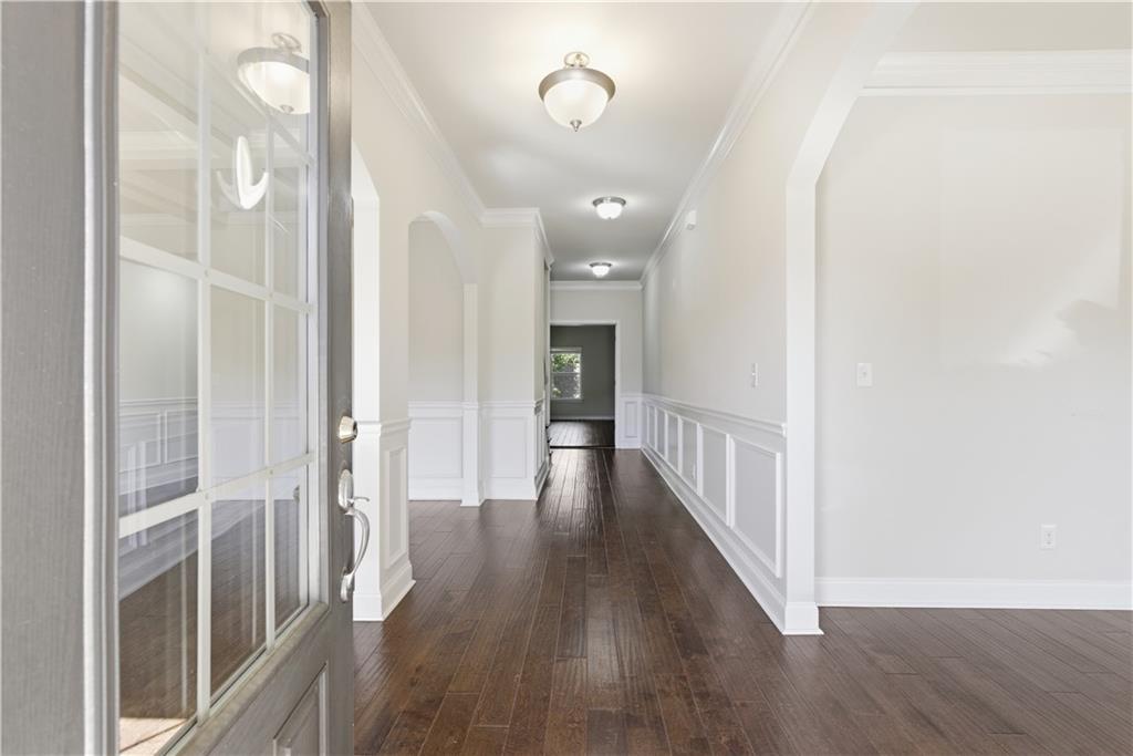 2573 Madison Mae Lane Grayson, GA 30017 - Photo 9 of 51 a view of a hallway with wooden floor