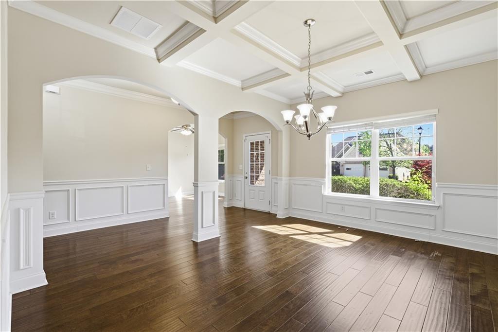 2573 Madison Mae Lane Grayson, GA 30017 - Photo 10 of 51 a view of a room with wooden floor chandelier and windows