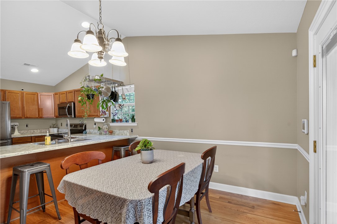 151 Towne Creek Trail Anderson, SC 29621 - Photo 13 of 49 A vaulted ceiling kitchen with a convenient breakfast bar transitions seamlessly to a comfortable dining area.