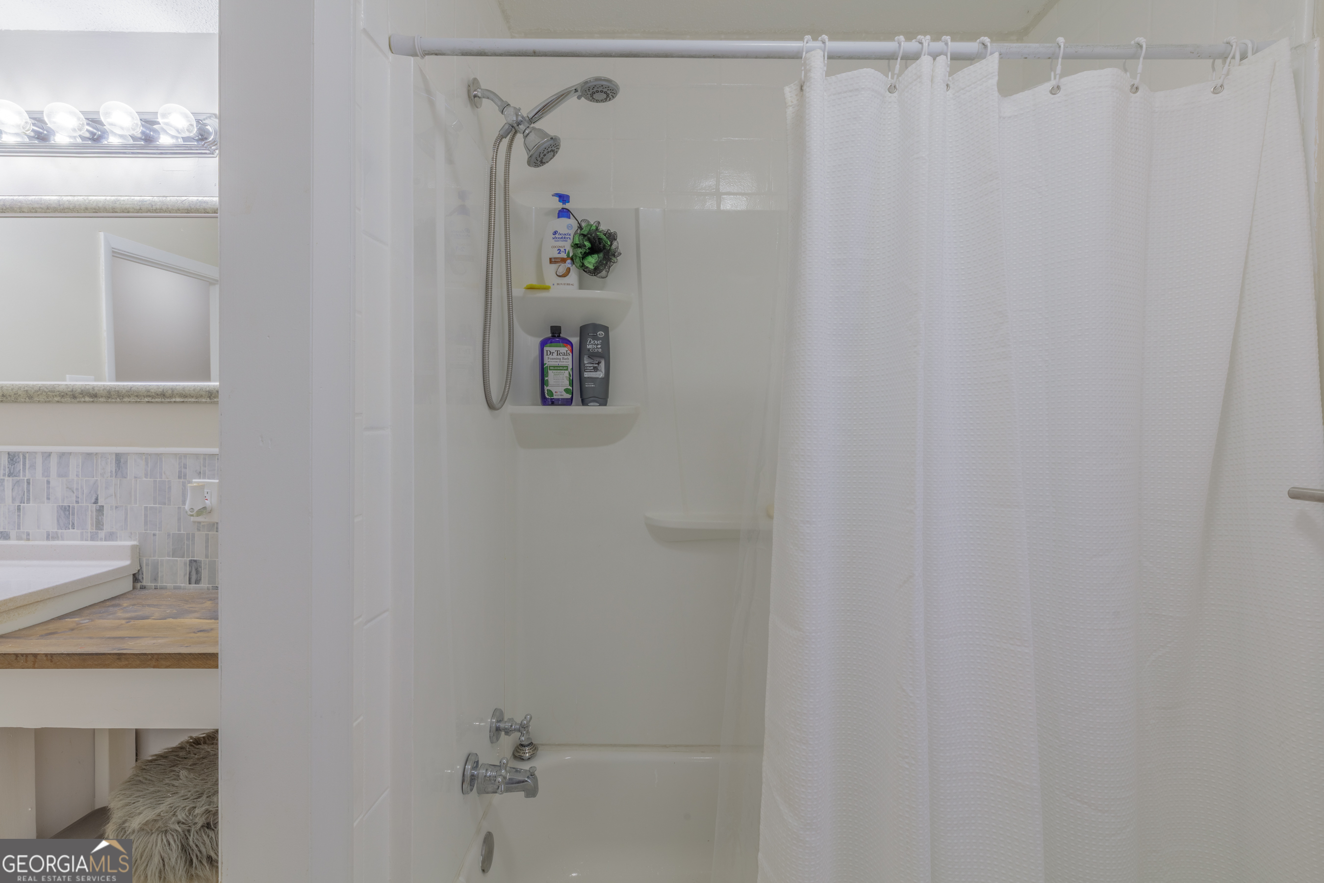 1144 Ridgeway Road LaFayette, GA 30728 - Photo 16 of 66 a bathroom with a shower curtain and a window