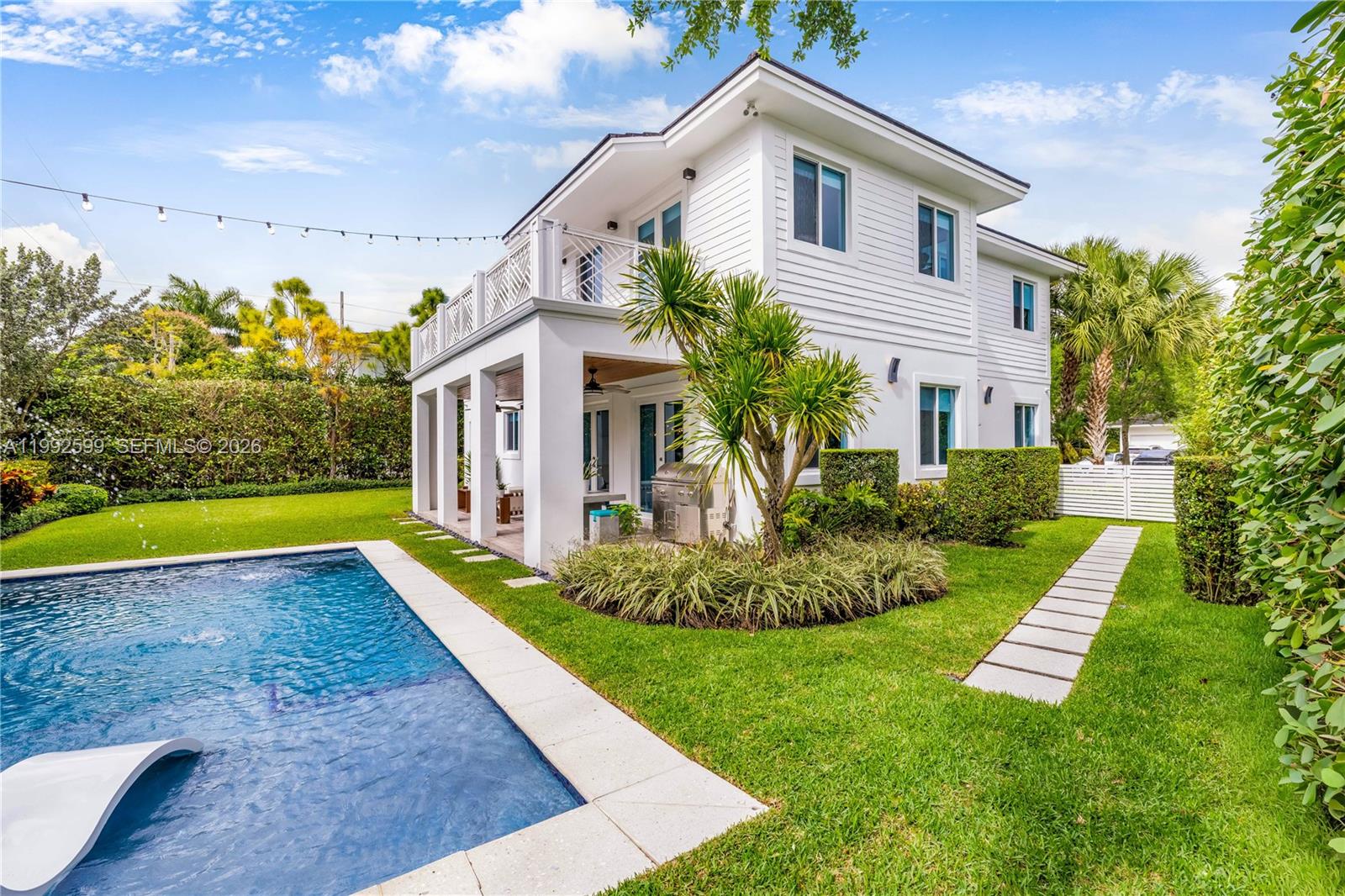 5602 Southwest 65th Court South Miami, FL 33143 - Photo 25 of 68 a view of a house with a yard and swimming pool