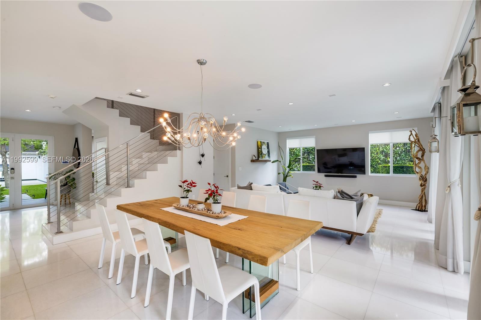 5602 Southwest 65th Court South Miami, FL 33143 - Photo 34 of 68 a view of a dining room with furniture and wooden floor