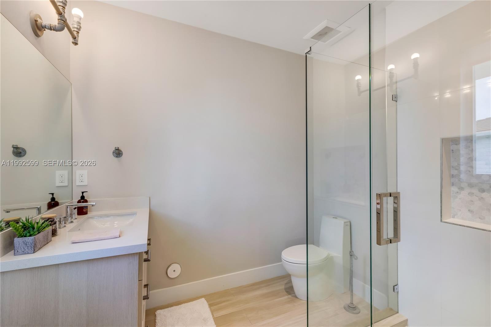 5602 Southwest 65th Court South Miami, FL 33143 - Photo 51 of 68 a bathroom with a sink a toilet and shower