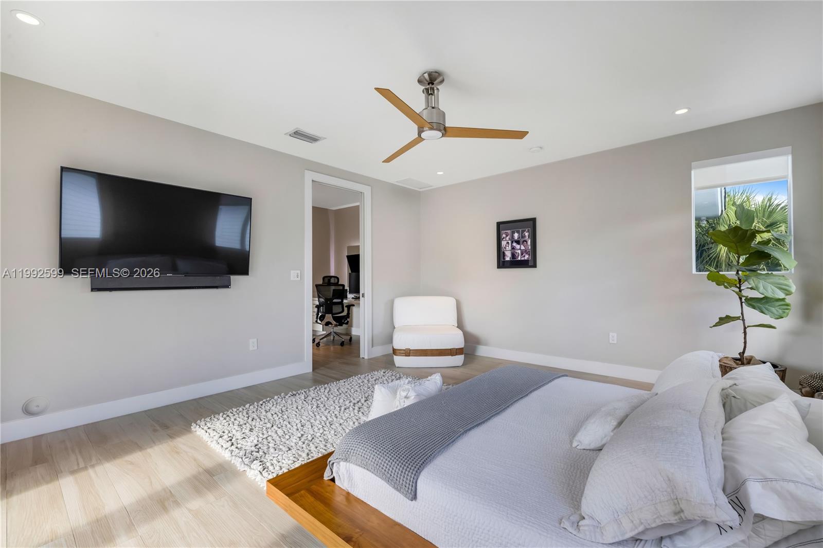 5602 Southwest 65th Court South Miami, FL 33143 - Photo 53 of 68 a bedroom with a bed and a flat screen tv