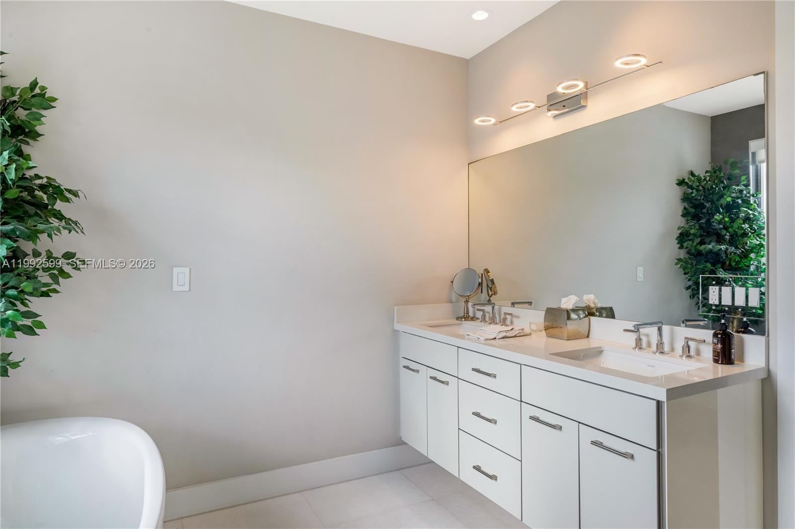 5602 Southwest 65th Court South Miami, FL 33143 - Photo 56 of 68 a bathroom with a sink and a mirror
