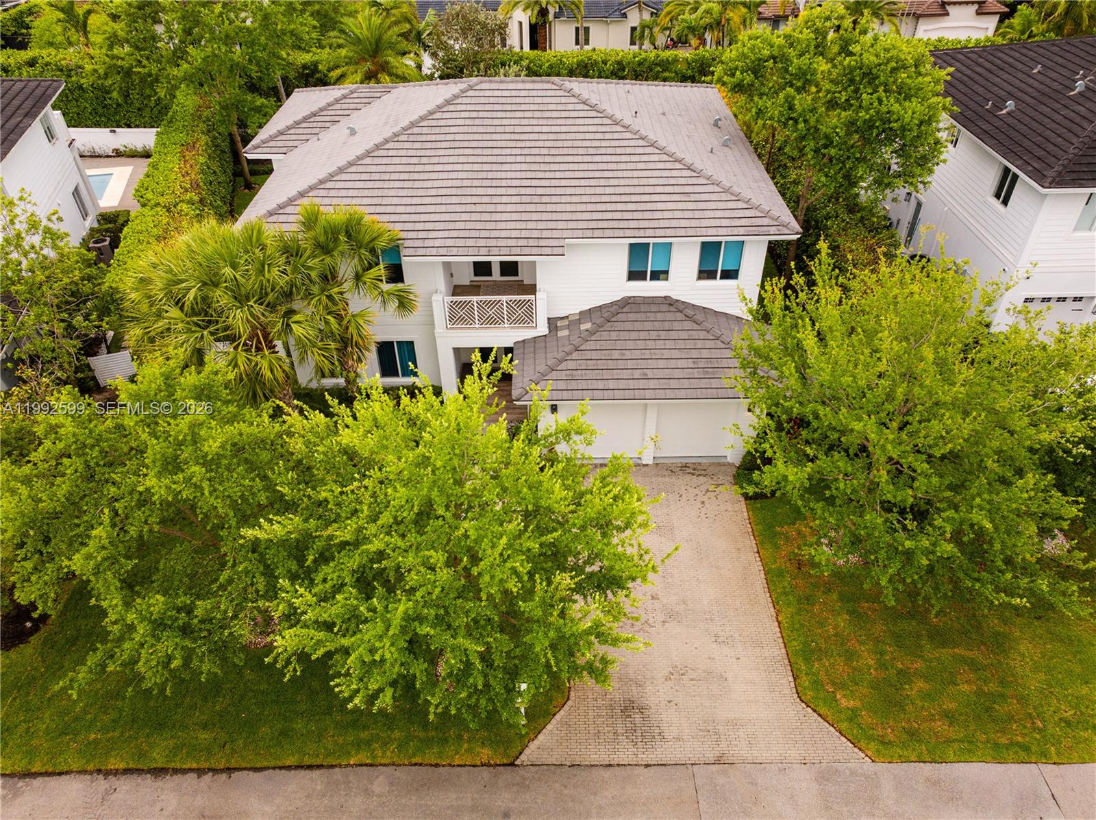 5602 Southwest 65th Court South Miami, FL 33143 - Photo 65 of 68 a aerial view of a house with a yard and potted plants