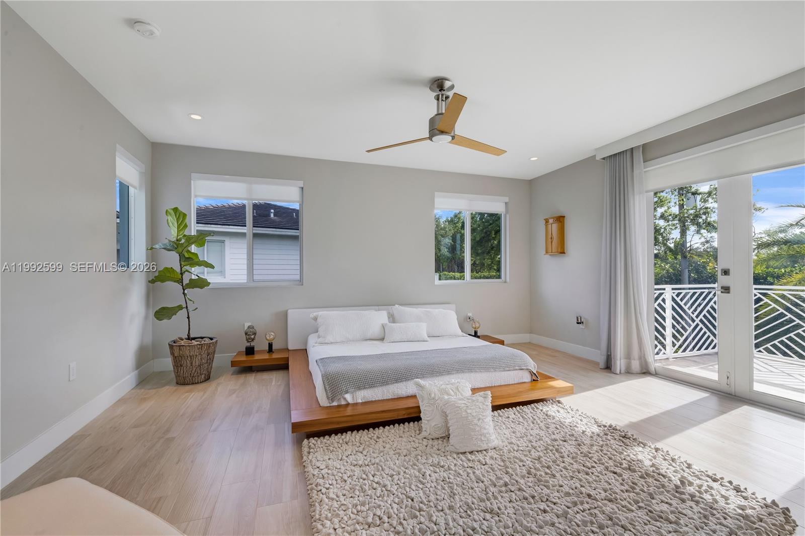 5602 Southwest 65th Court South Miami, FL 33143 - Photo 9 of 68 a living room with furniture a rug and a large window