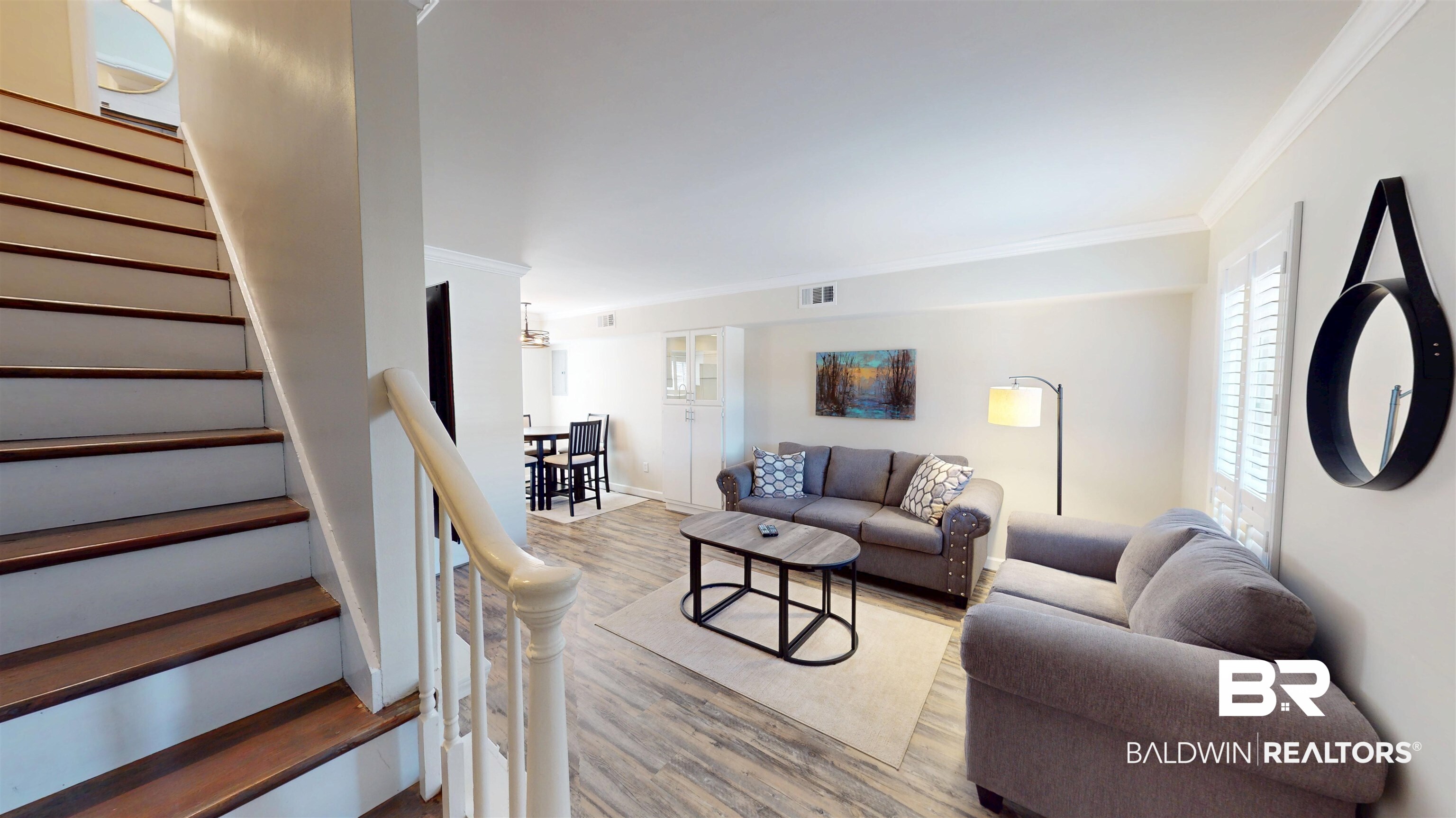 100 Du Rhu Drive, Unit J Mobile, AL 36608 - Photo 8 of 17 Living area with crown molding and wood finished floors