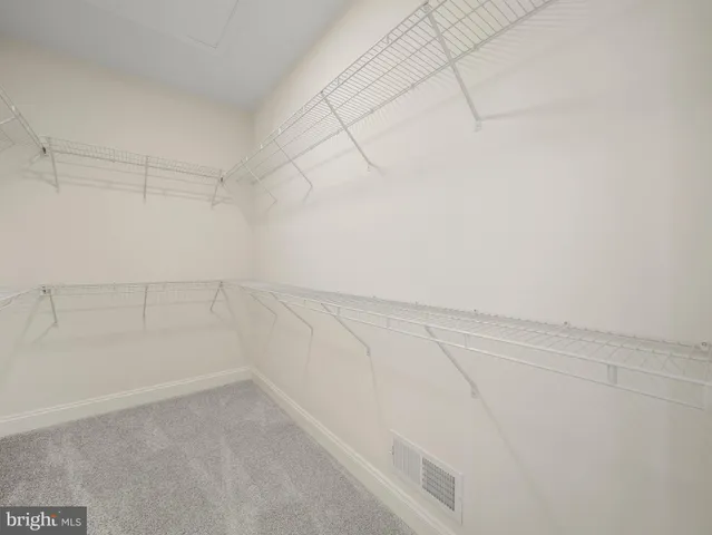 a view of a room with racks on the wall