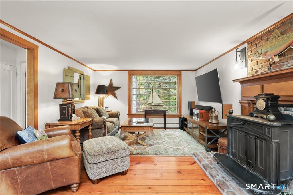 47 Hollow Tree Ridge Road, Unit 47 Darien, CT 06820 - Photo 1 of 33 Liviing Room with Wood Stove