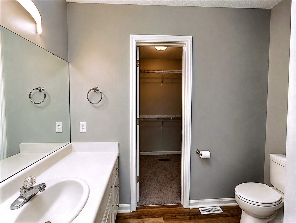 124 Woodbridge Court Anderson, SC 29621 - Photo 12 of 15 This primary bathroom offers a convenient walk-in closet for ample storage.