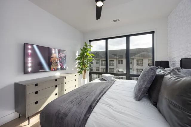 a bathroom with a double vanity sink toilet and shower