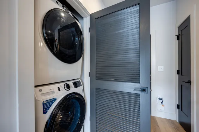 a view of a balcony with wooden floor and fence
