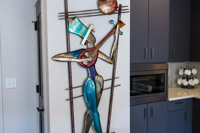 a room with a sink and cabinets