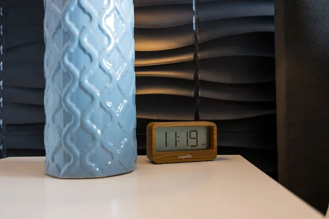 a view of a room with a table and a potted plant