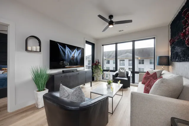 a living room with furniture and a flat screen tv