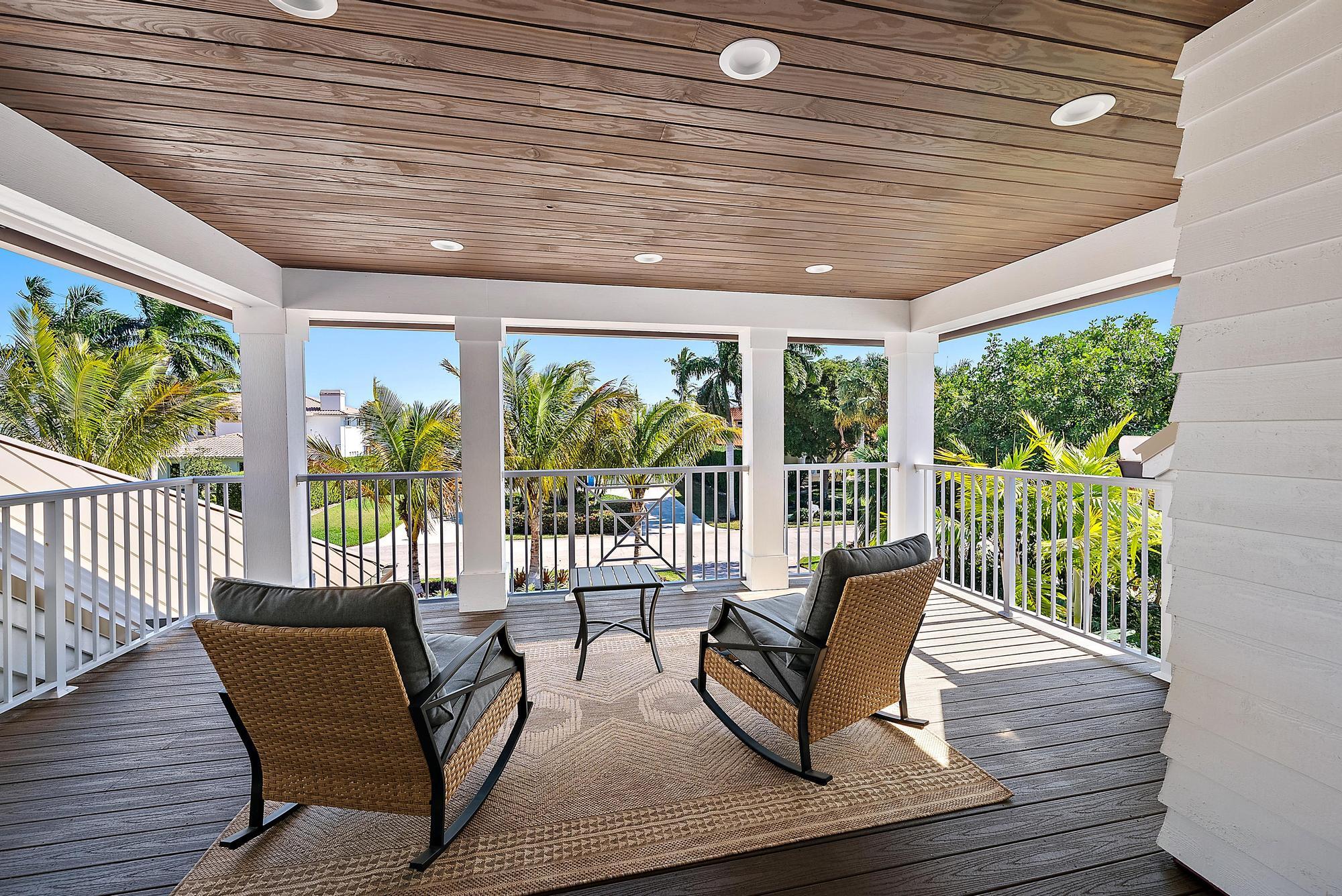 19 Island Road Sewall's Point, FL 34996 - Photo 29 of 50 a balcony with furniture and wooden floor