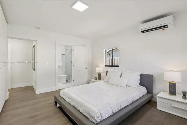 a bedroom with a bed and a night lamp